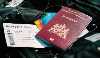a passport and a boarding pass are on a bag