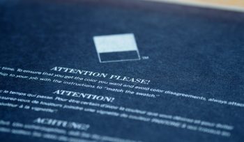 white card on blue textile
