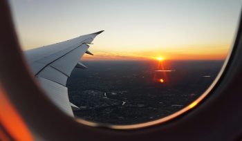 airplanes window view of sky during golden hour