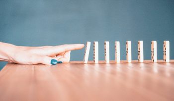 person holding white and blue plastic blocks