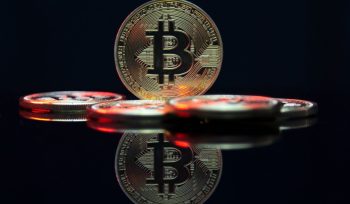 a bit coin sitting on top of a table