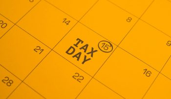 Calendar shows "tax day" circled on the 15th.