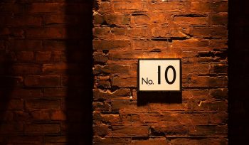 no. 10 sign on brick wall