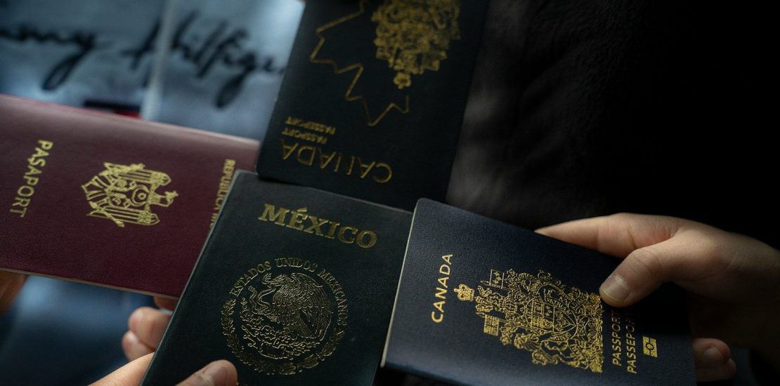 Four passports held by different people. Cross-border estate planning for international families with Wills and assets in multiple countries.