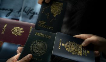 Four passports held by different people. Cross-border estate planning for international families with Wills and assets in multiple countries.