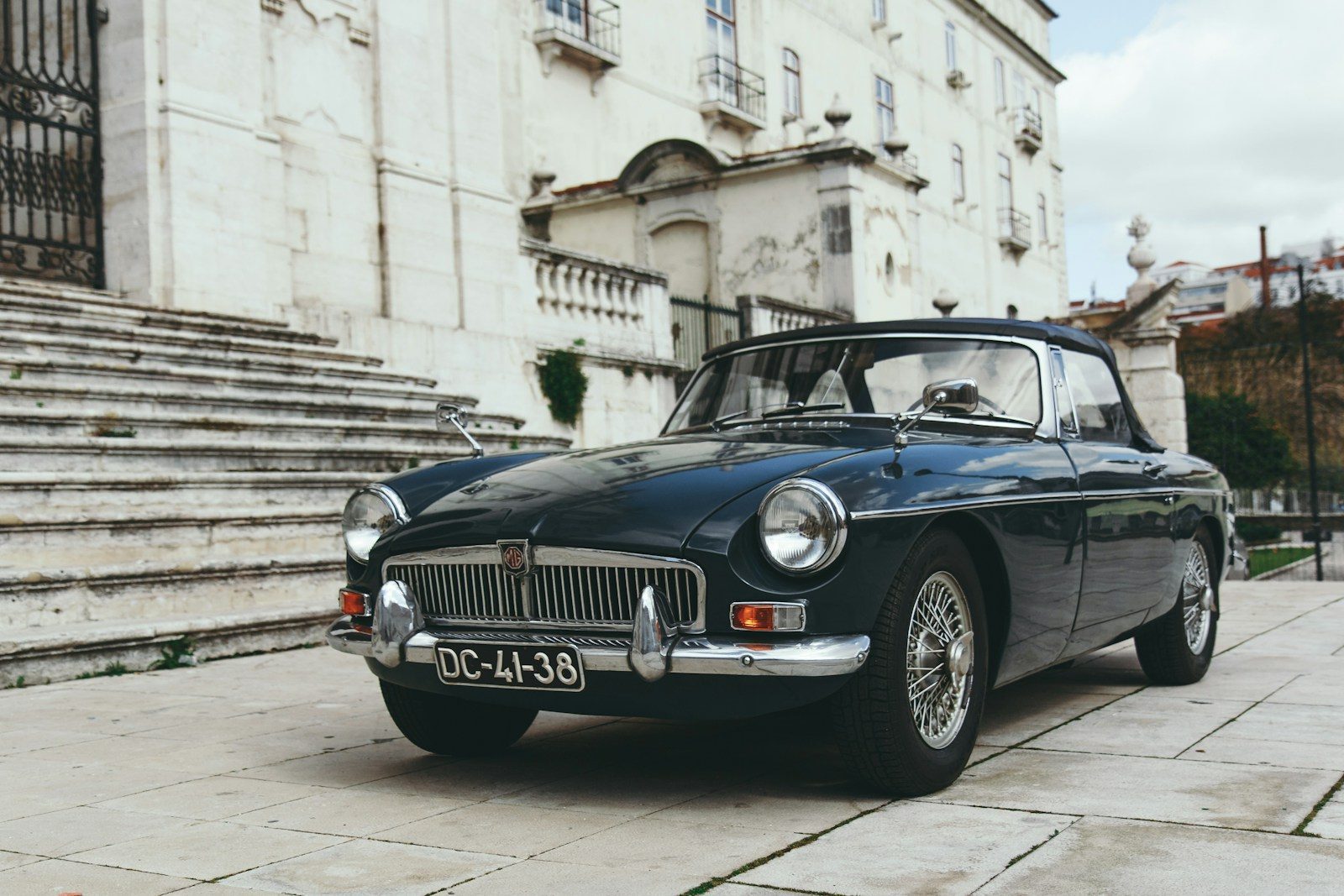 blue coupe near gray concrete staircase Estate Planning for Car Collectors