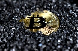 Gold Bitcoin cryptocurrency coin on dark gravel background, representing digital asset inheritance and what happens to your crypto and Digital assets when you die