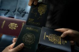 Four passports held by different people. Cross-border estate planning for international families with Wills and assets in multiple countries.